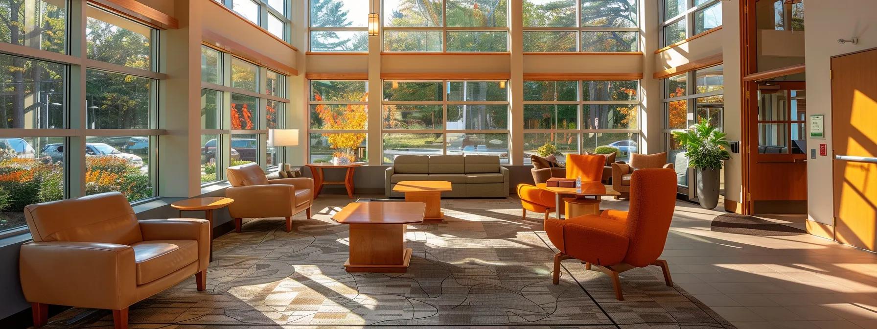 a sunlit and welcoming addiction treatment center in massachusetts, featuring modern furnishings and clients engaged in group therapy discussions, embodies hope and the importance of understanding costs and insurance for effective recovery. a sunlit and welcoming addiction treatment center in massachusetts, featuring modern furnishings and clients engaged in group therapy discussions, embodies hope and the importance of understanding costs and insurance for effective recovery.